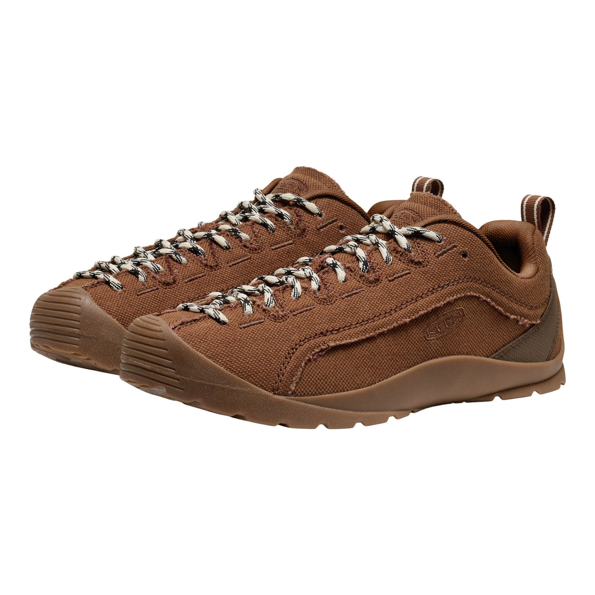 A pair of brown canvas lace-up shoes with textured laces and a matching brown sole, shown on a plain white background.