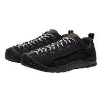 Black running shoes with a visible brand logo on a white background