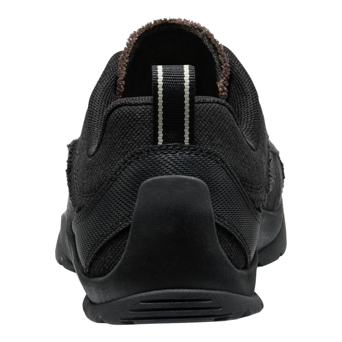 A black slip-on shoe with a textured mesh upper, a thick black sole, and a brown fuzzy lining visible at the collar, shown from a rear three-quarter view on a white background.