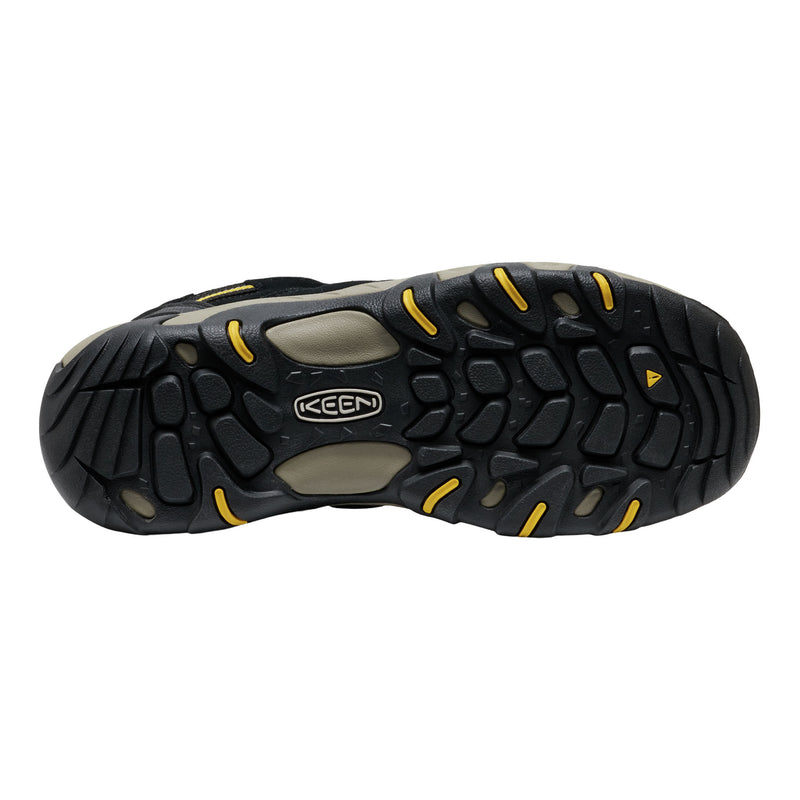Black and yellow Keen shoe sole on a white background