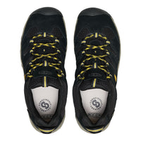 Black hiking shoes with yellow laces on a white background