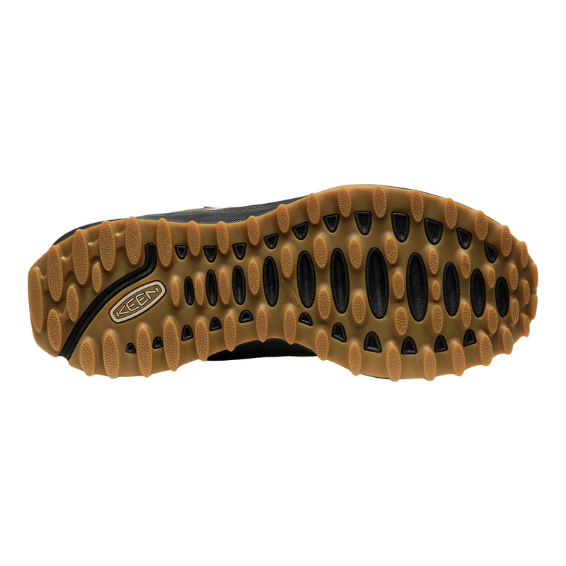Close-up of a shoe sole with a brand logo on a white background