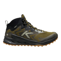 Hiking boot with black and green design on a white background
