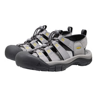 Pair of gray and black sandals with yellow accents on a white background