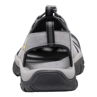 Gray sandal with black sole on a white background