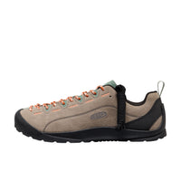Brown hiking shoe with orange accents on a white background