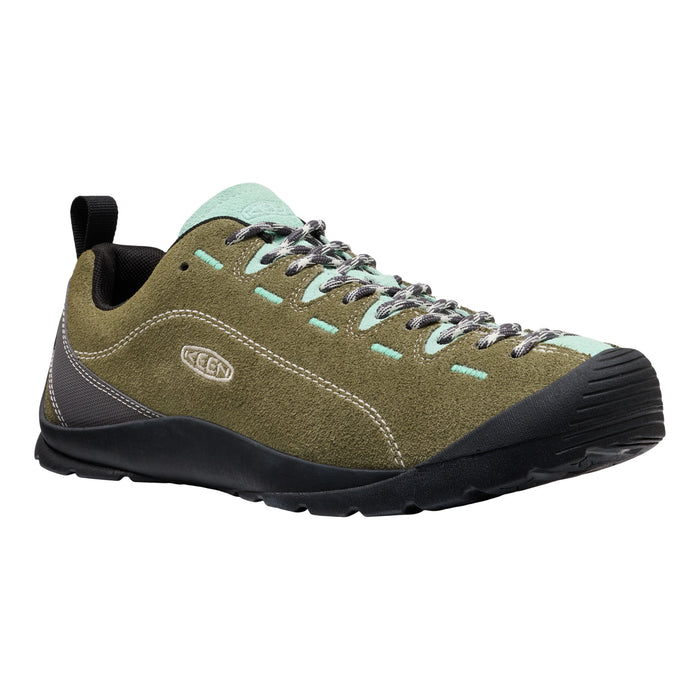 Green hiking shoe with black sole on a white background