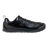 Black sports shoe with a brown sole on a white background