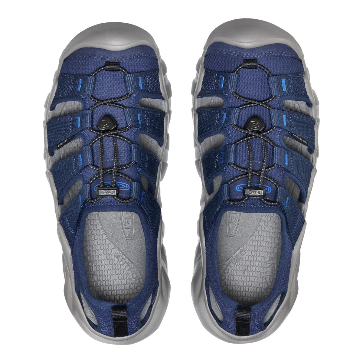 Blue and gray hiking sandals on a white background