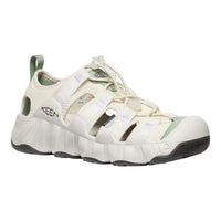 White sandal with green accents on a white background