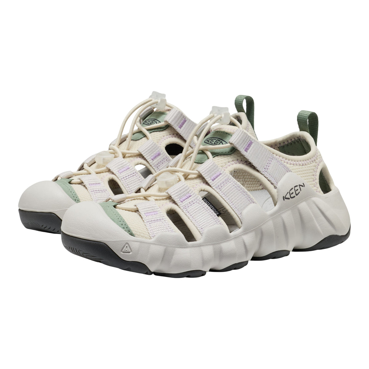 Pair of white and green Keen sandals on a white background