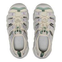 Pair of white and green sandals on a white background
