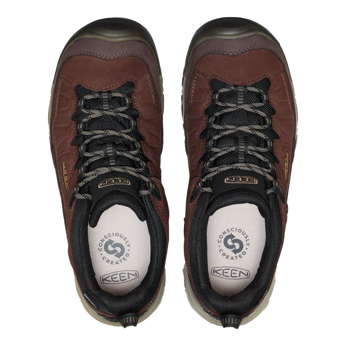 A pair of Keen hiking shoes shown from a top-down view on a plain white background. The shoes are primarily dark brown with black laces, black collar trim, and a white insole featuring the Keen logo.