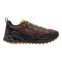 Brown and black hiking shoe with textured sole on a white background