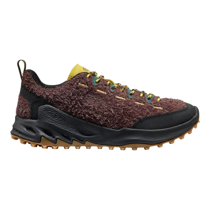 Brown and black hiking shoe with textured sole on a white background
