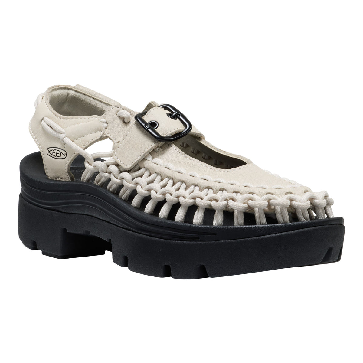 White sandal with black sole on a white background