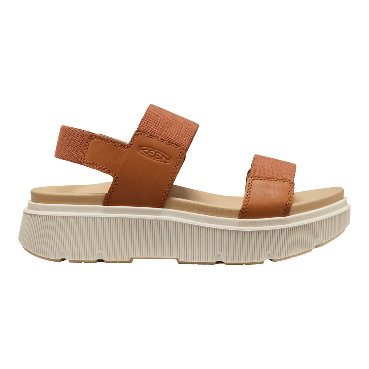 Brown sandal with white sole on a white background