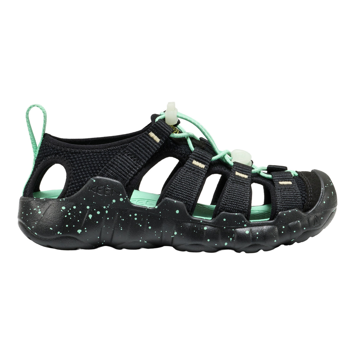 Black sandal with green accents on a white background