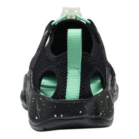 Black and green sandal with a strap on a white background