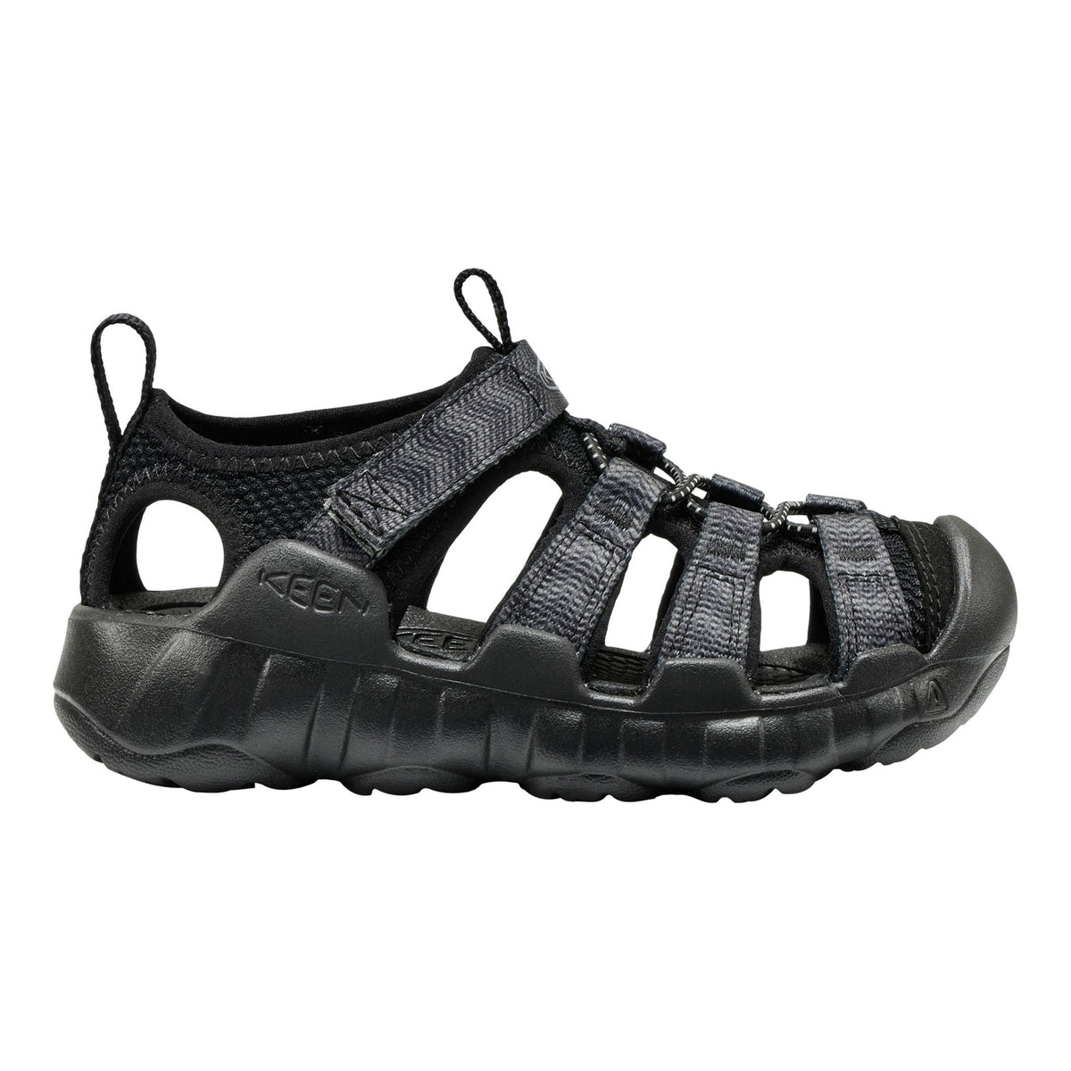 A black Keen sandal with multiple adjustable straps and a thick textured sole, shown in a side profile on a white background.