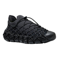 Black lace-up sneaker on a white background