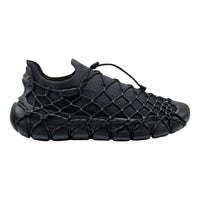 Black shoe with white accents on a white background