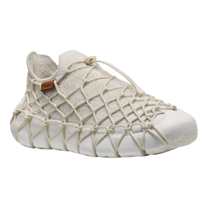 A low-top sneaker featuring a textured off-white knit upper covered in an intricate cream-colored rope net pattern, with a white rubber toe cap and matching rope laces.