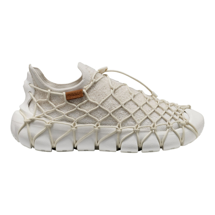 A single slip-on sneaker with a chunky white textured sole and a beige mesh upper wrapped in a crisscross rope net pattern, shown against a plain white background.