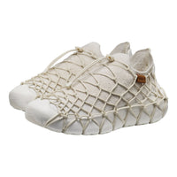 A pair of slip-on sneakers with thick, textured off-white mesh upper covers and thick white rubber toe caps and soles, shown on a plain white background.
