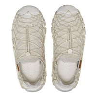 A pair of slip-on mesh sneakers with a thick, knotted off-white rope overlay, shown from a top-down view on a white background.