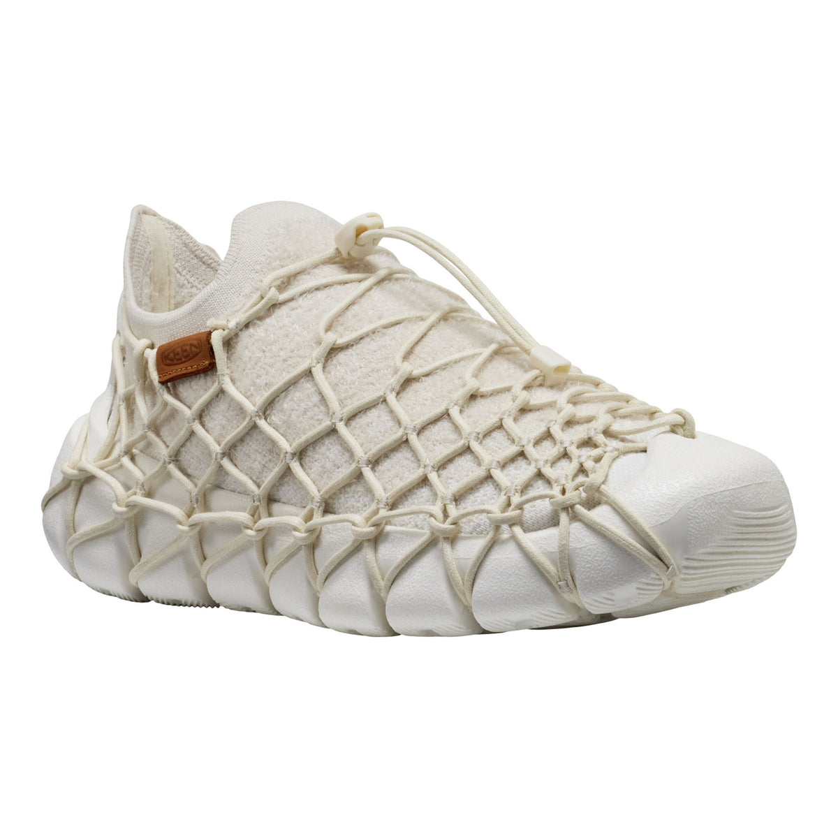 White shoe with woven design on a white background
