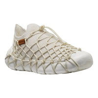 White shoe with woven design on a white background