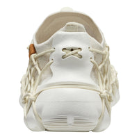 White sneaker with unique sole design on a white background