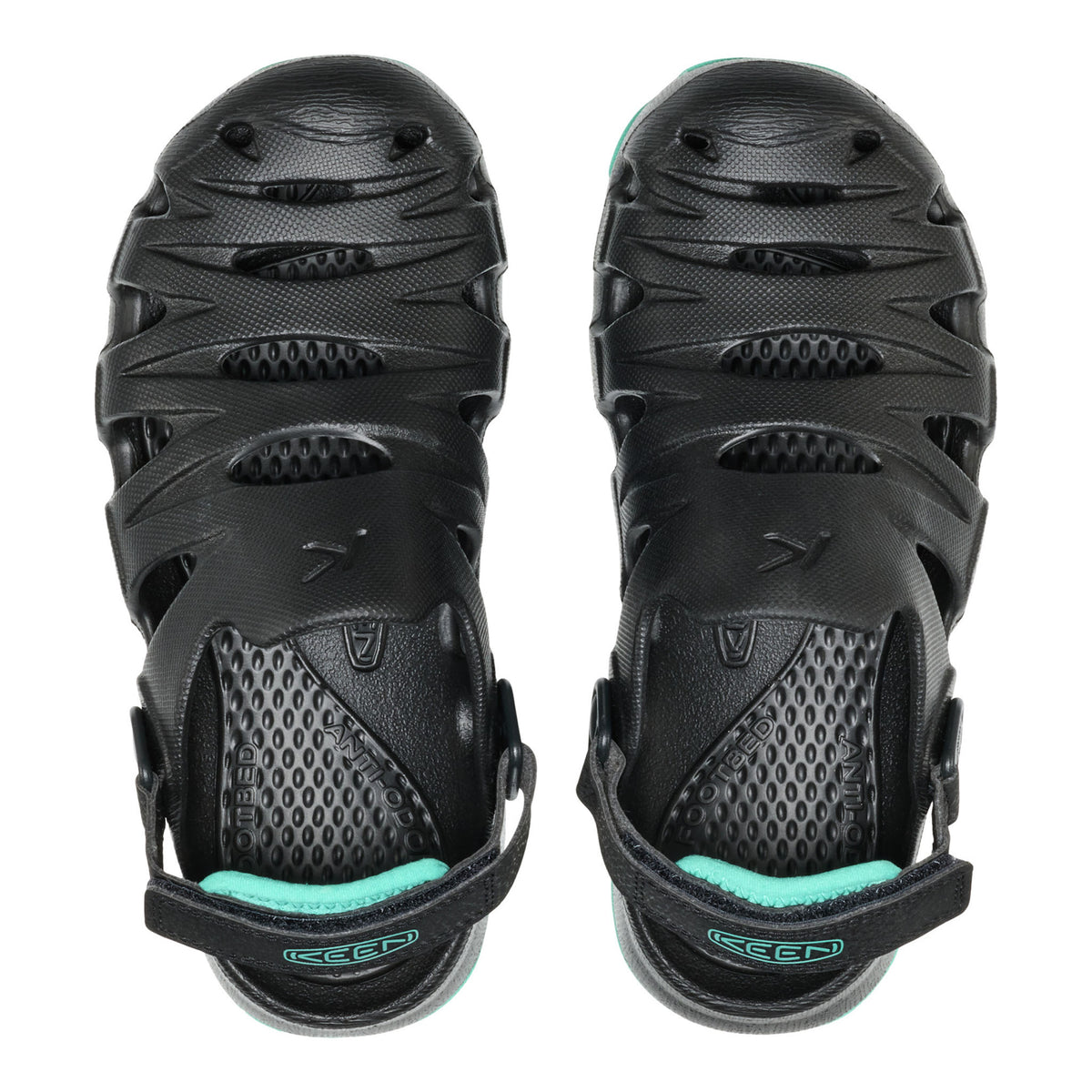 Black sandals with teal accents on a white background