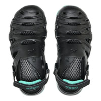 Black sandals with teal accents on a white background
