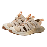 Beige and brown sandals with white soles on a white background