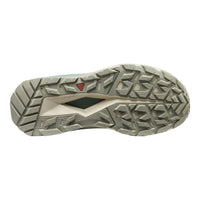 The outsole of a trail running shoe, showing a textured, multi-directional tread pattern in a light gray and beige colorway with a small red Keen logo.