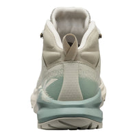 A high-top athletic shoe shown from the rear, featuring a light beige and off-white upper with a mint green gradient midsole and heel accent.