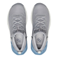 Gray athletic shoes with blue soles on a white background