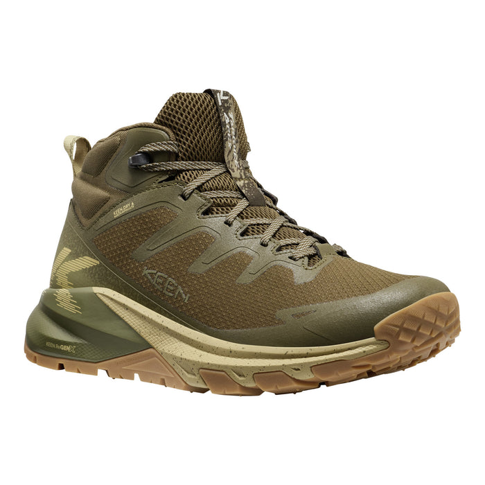Green hiking boot with brown sole on a white background