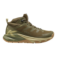 Green hiking boot with brown sole on a white background