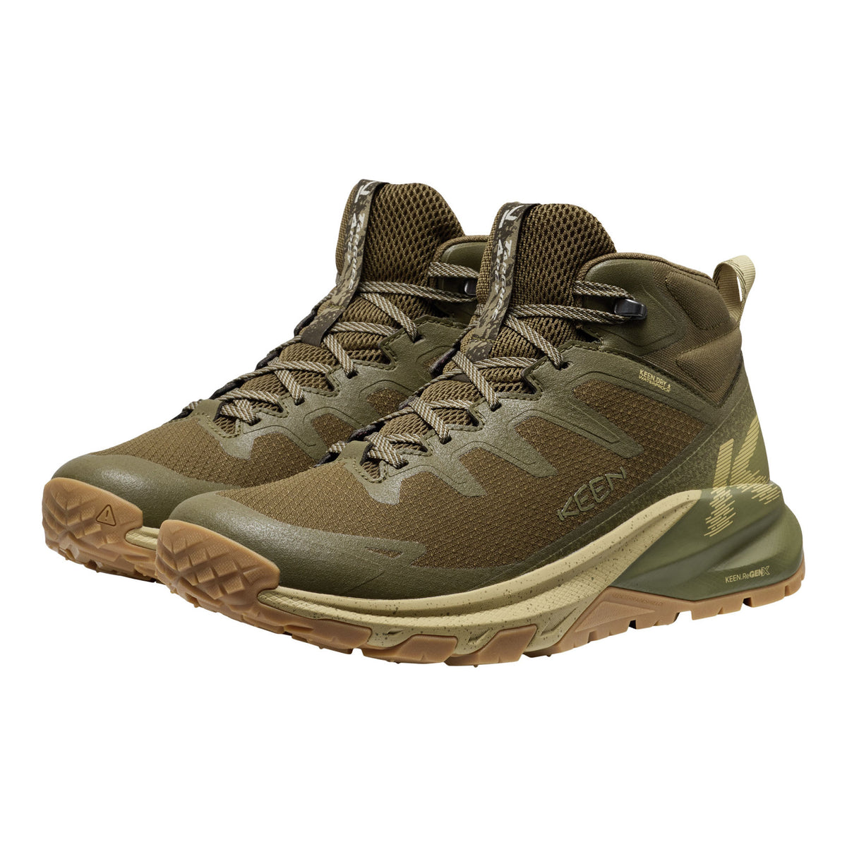 Pair of green hiking boots with brown soles on a white background