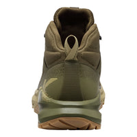 Green hiking boot with brown sole on a white background