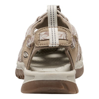 Brown sandal with white sole on a white background