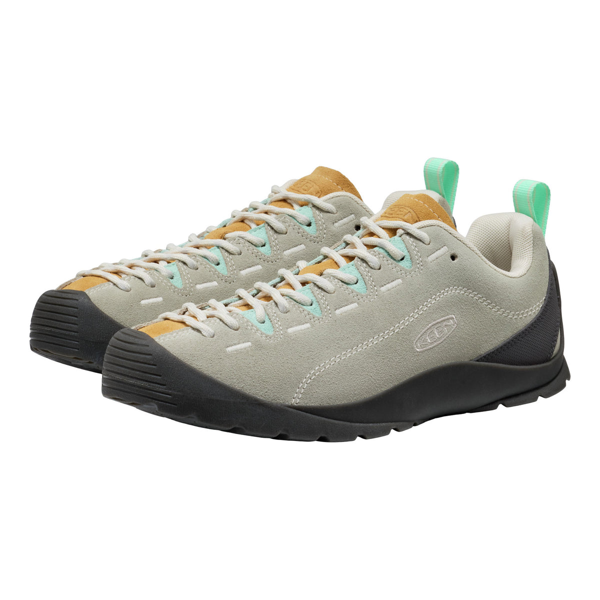 Pair of grey and yellow sneakers with green accents on a white background
