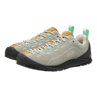 Pair of grey and yellow sneakers with green accents on a white background