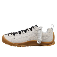 White sneaker with black accents on a white background