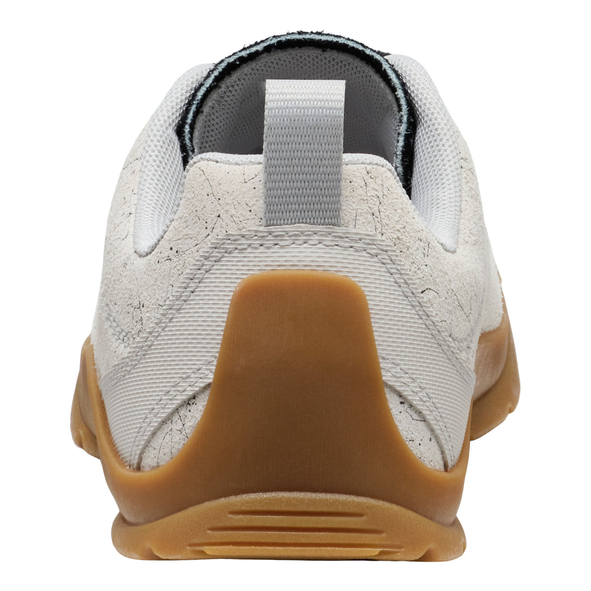 White sneaker with brown sole on a white background