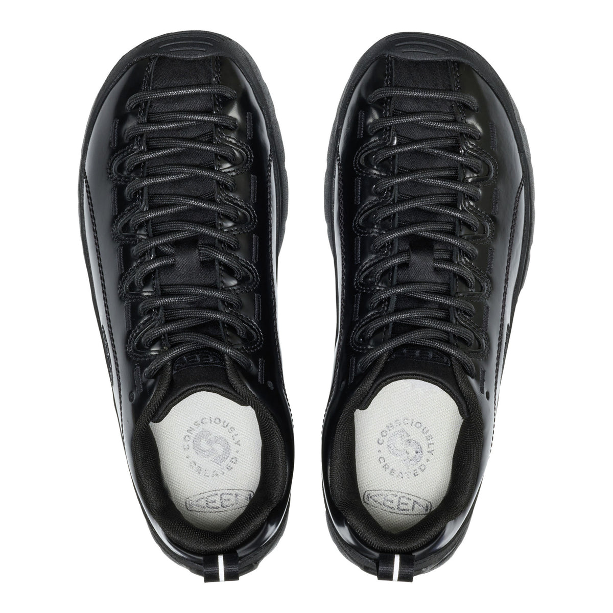 Black high-top sneakers with white soles on a white background