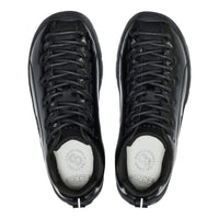 Black high-top sneakers with white soles on a white background